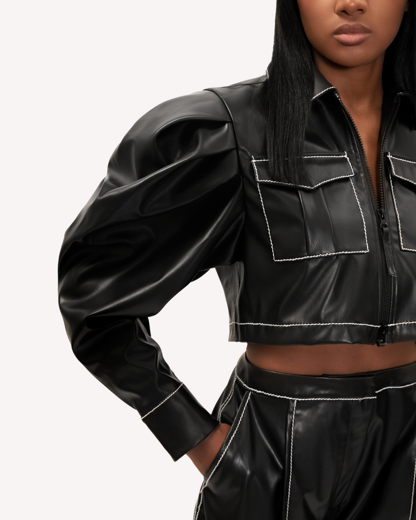 Womens black fall winter cropped vegan leather Caldwell Shacket top with pleated puff sleeves zip front and cargo pocket details. Close View.
