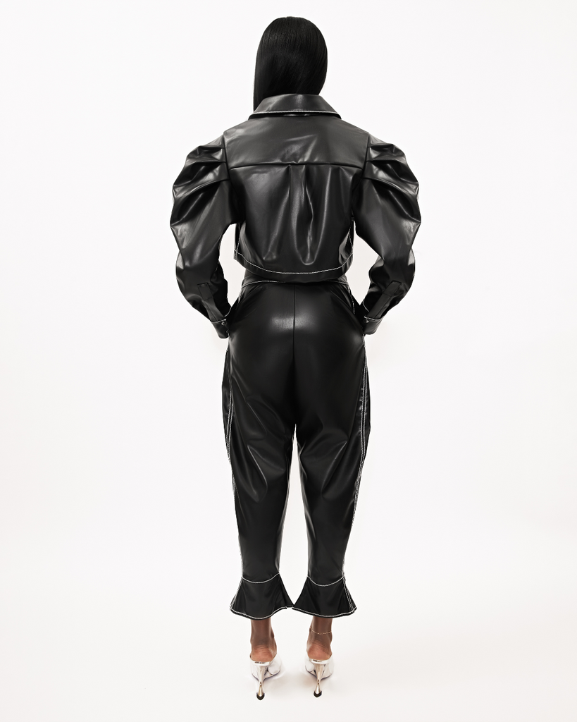Womens black fall winter cropped vegan leather set with Caldwell Shacket top with pleated puff sleeves zip front and cargo pocket details. The vegan leather black Johnnie Sue balloon pant are also shown back view.