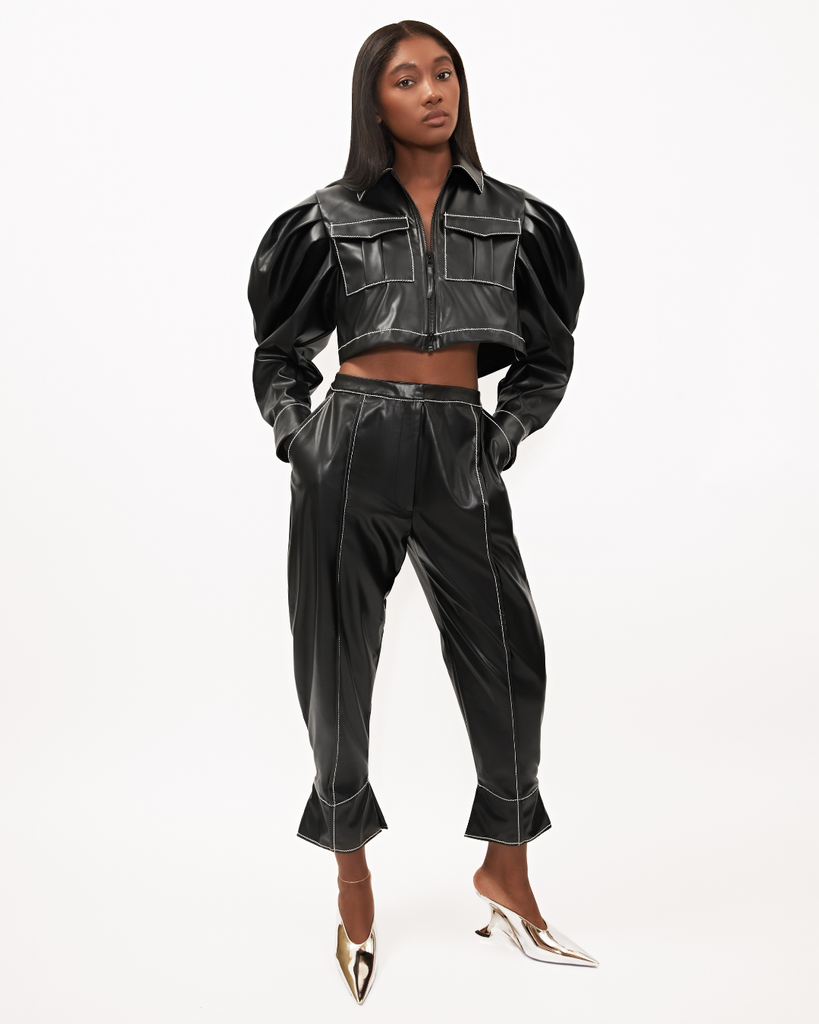 Womens black fall winter cropped vegan leather set with Caldwell Shacket top with pleated puff sleeves zip front and cargo pocket details. The vegan leather black Johnnie Sue balloon pant are also shown frontal view.